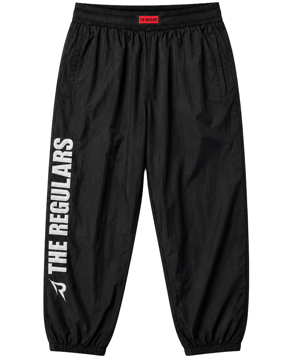THE REGULARS PERFORMANCE TRACK PANTS BLACK - RELIABLE